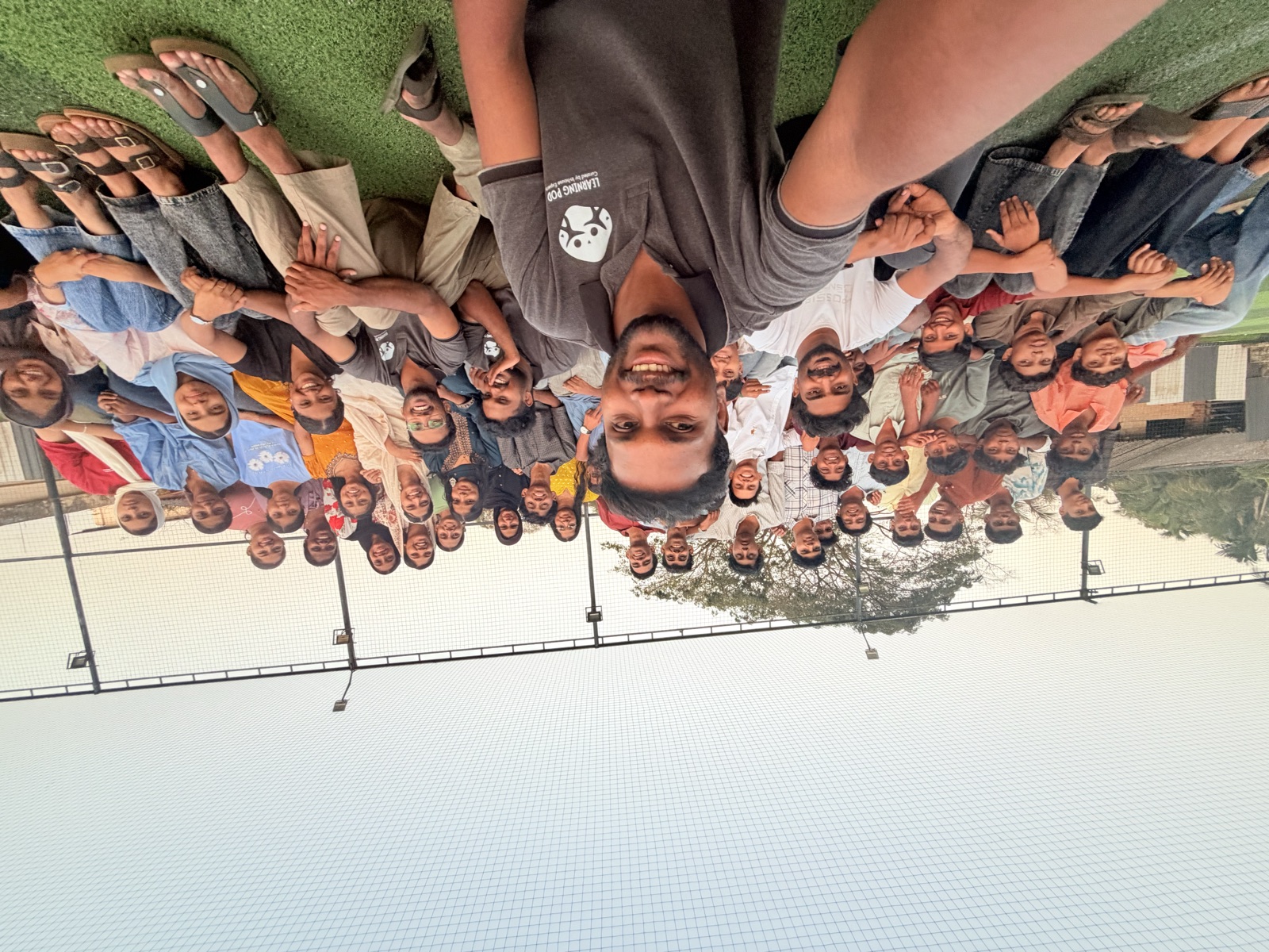 The whole Learning Pod team selfie on the turf