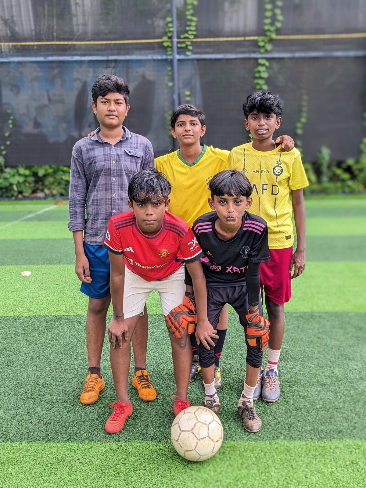 Learning Pod football team on the turf