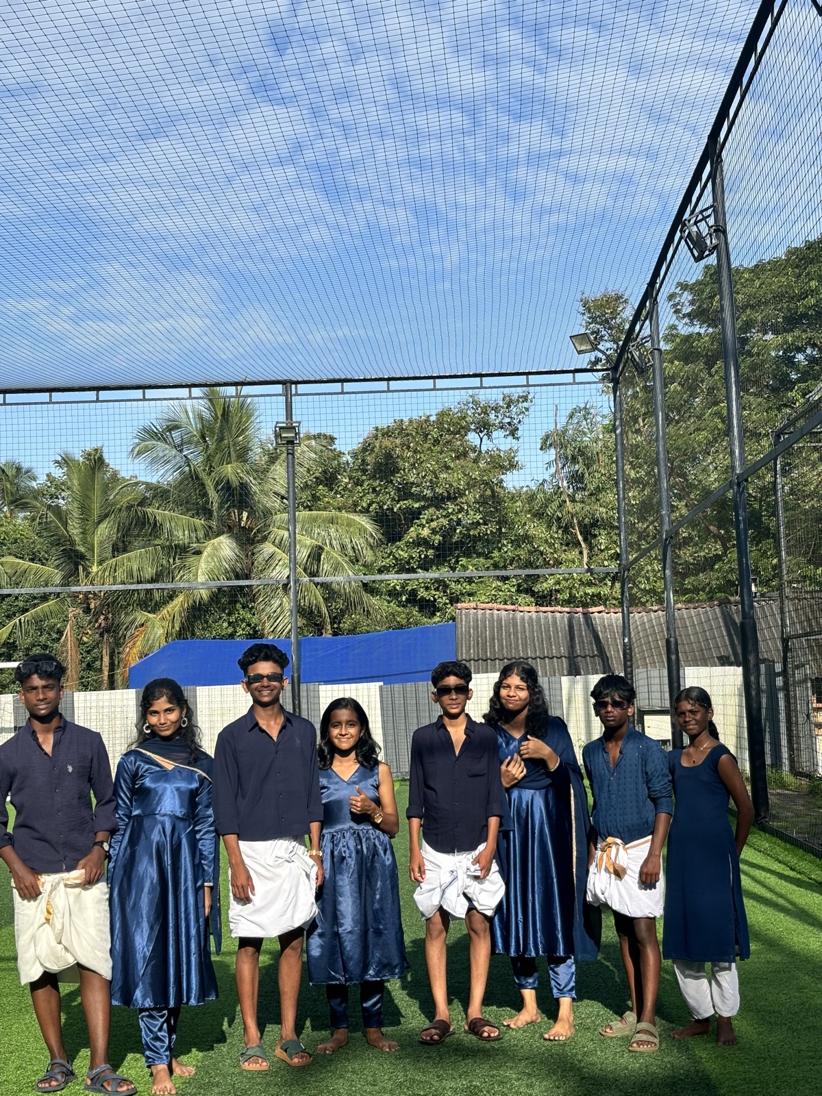 Students in navy performance costumes